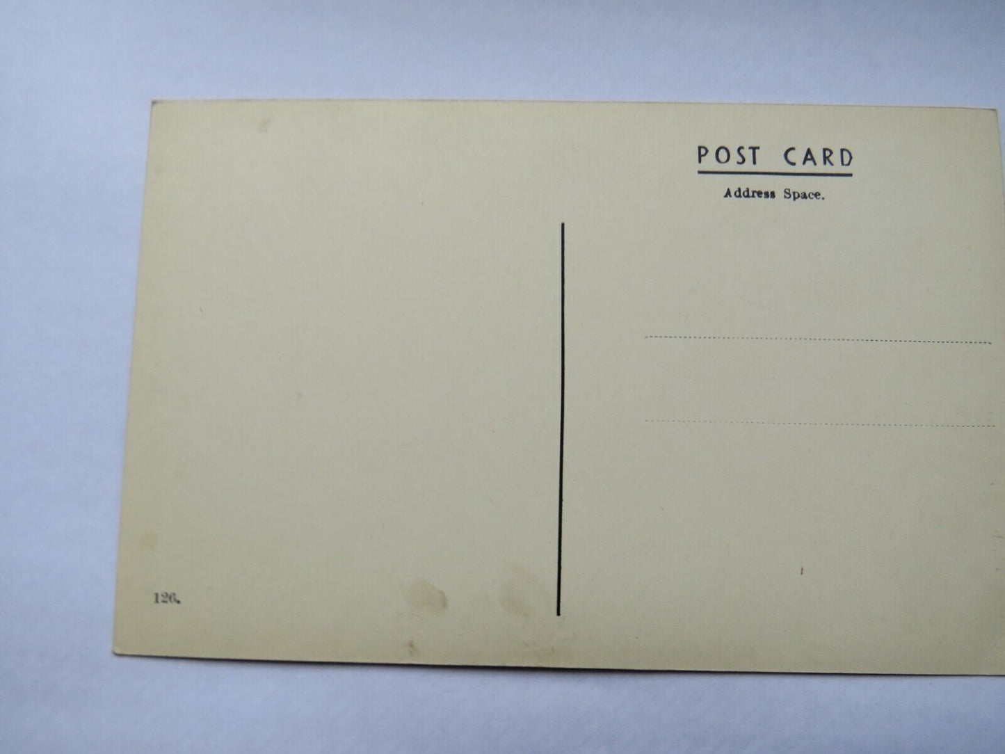 Old Postcard Of A Pilgrim at the Blarney Stone