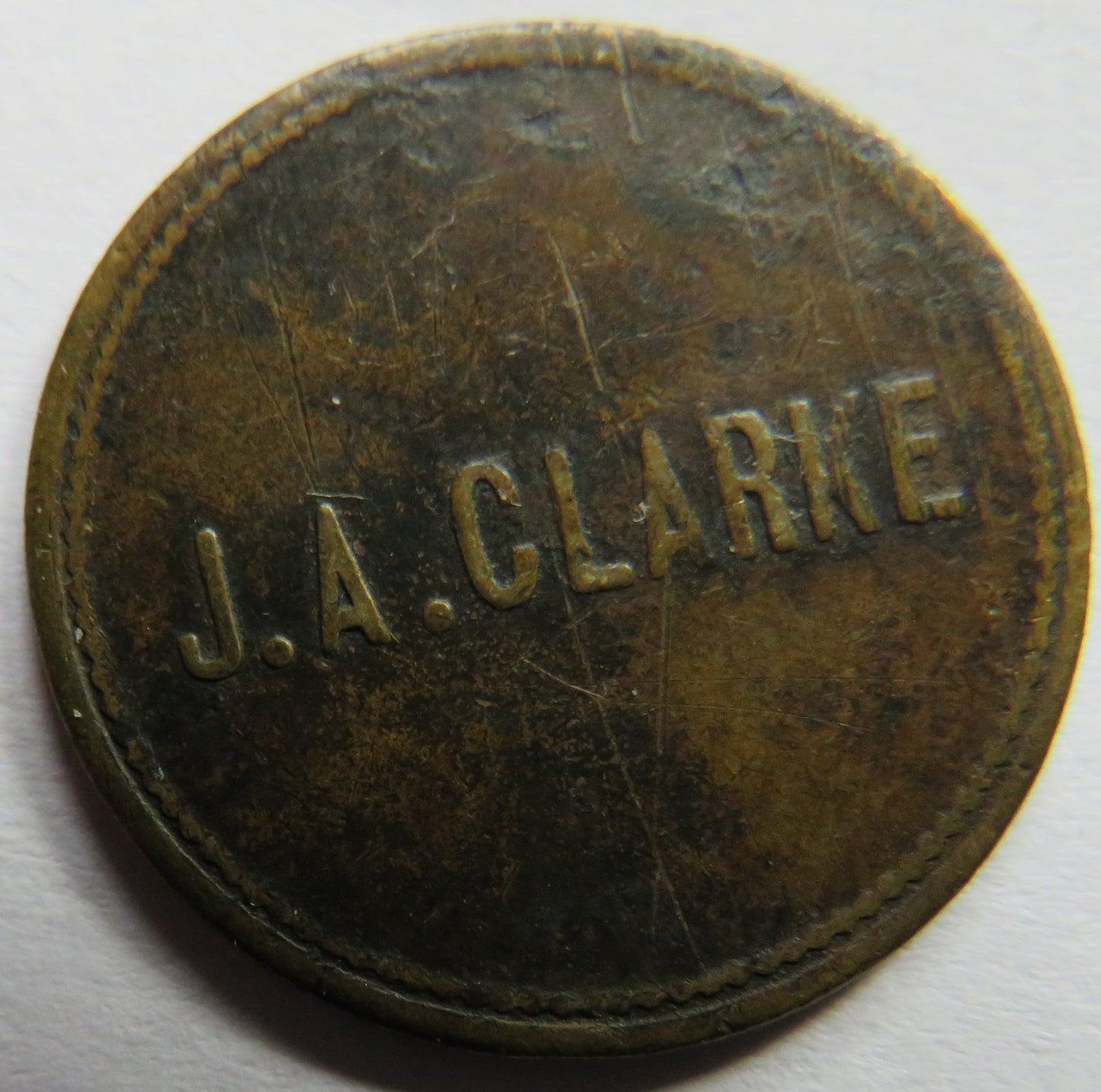 1 & 1/4d J.A. Clarke Antique Token