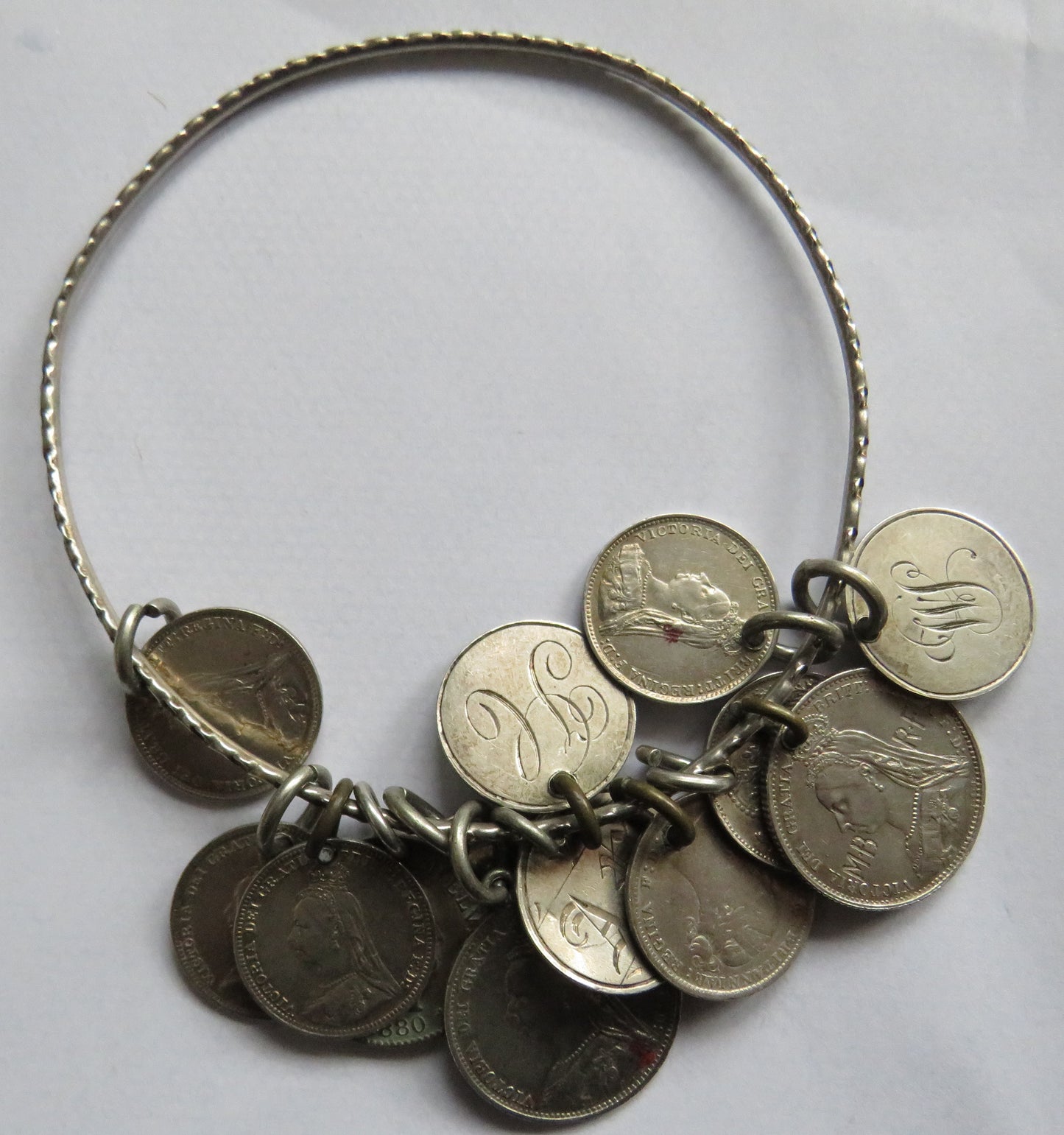 An Excellent Silver Bangle With 13 Victorian Engraved Love Tokens, Threepence, Sixpence etc.