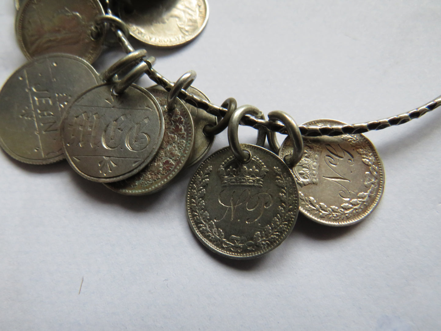 An Excellent Silver Bangle With 13 Victorian Engraved Love Tokens, Threepence, Sixpence etc.