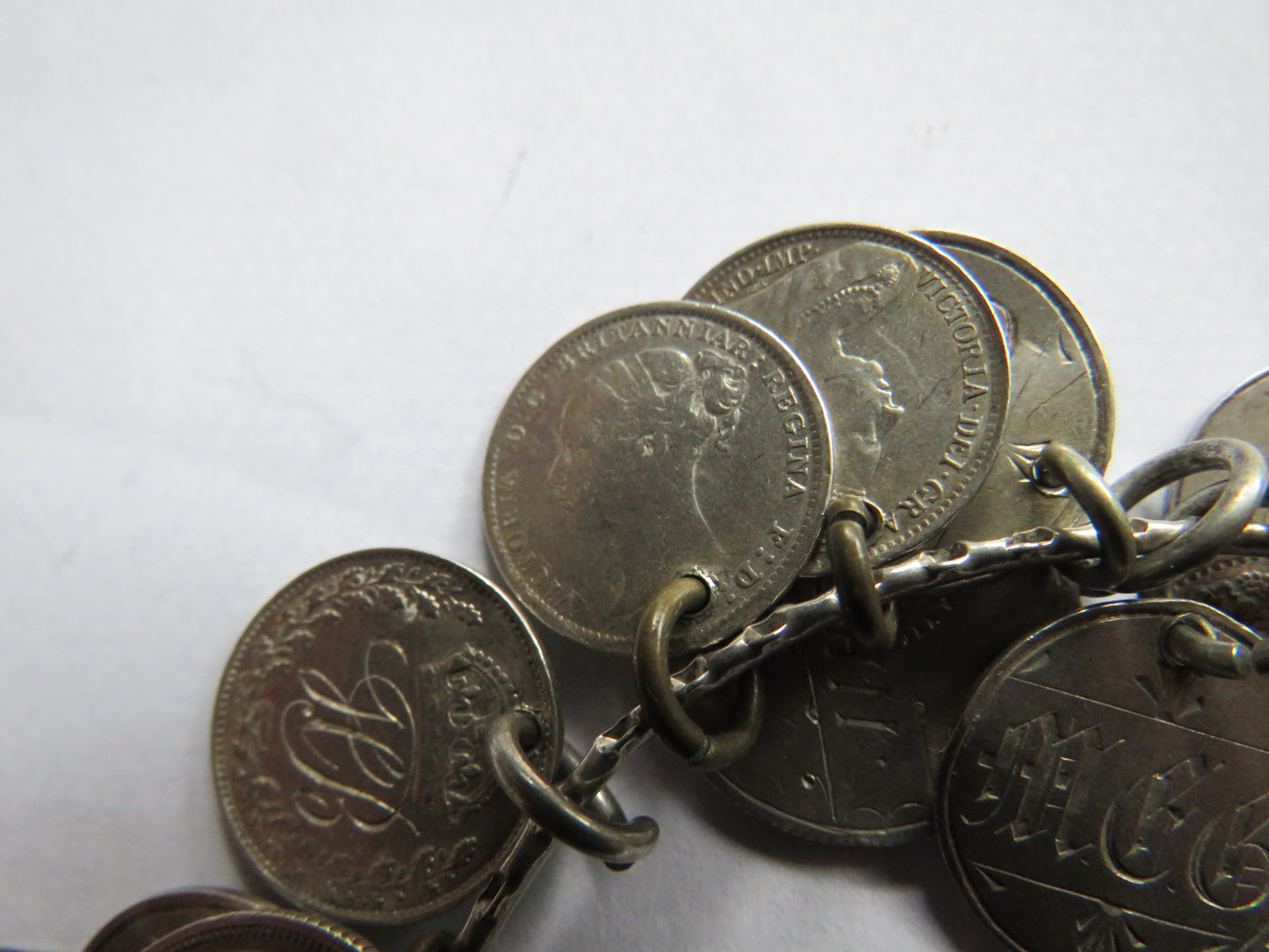 An Excellent Silver Bangle With 13 Victorian Engraved Love Tokens, Threepence, Sixpence etc.