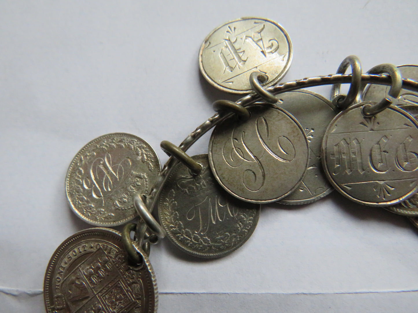 An Excellent Silver Bangle With 13 Victorian Engraved Love Tokens, Threepence, Sixpence etc.