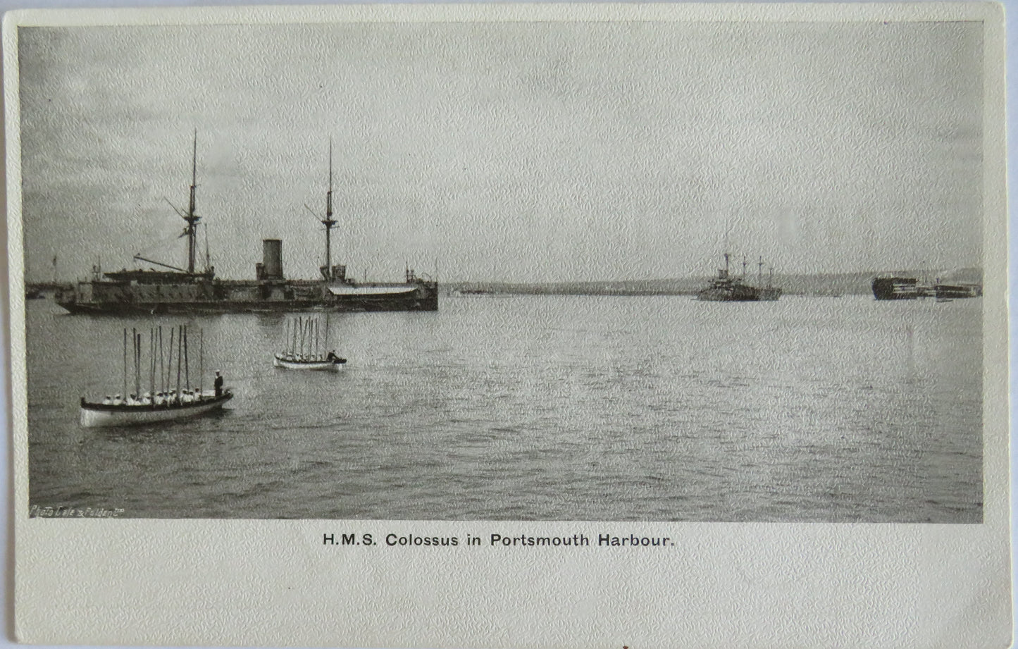 Antique Postcard of H.M.S. Colossus In Portsmouth Harbour