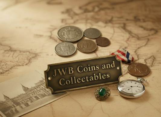 Antique-style JWB Coins and Collectables sign on a vintage map with a pocket watch, medal ribbon, jewellery and British pre-decimal coins.