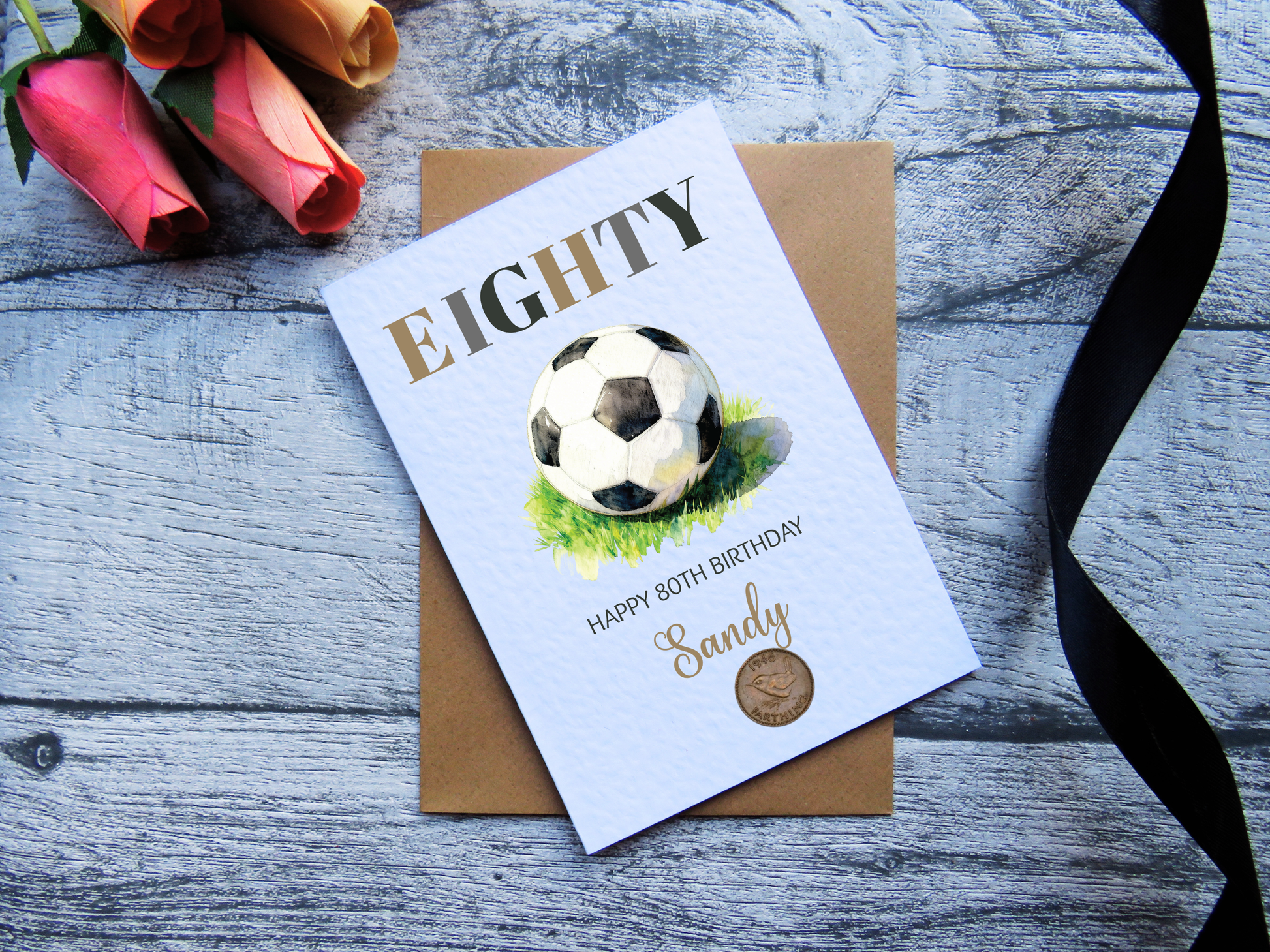Football 80th Birthday Card with Real 1946 Coin on wooden surface with black ribbon