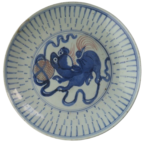 Ceramic plate with blue and white design of two animals and a basket on a white background