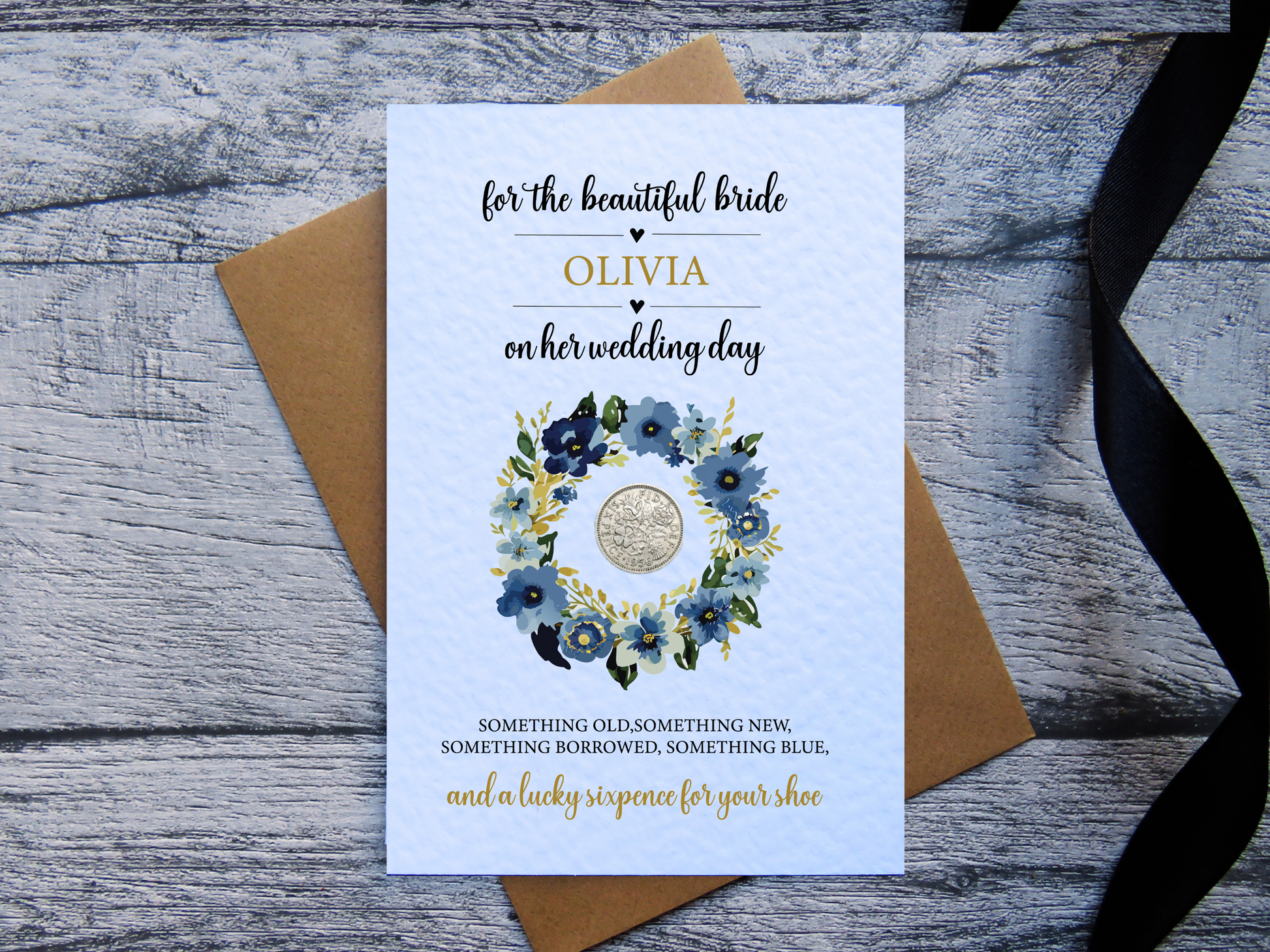 Personalised bride to be wedding card with blue floral wreath and real lucky sixpence 