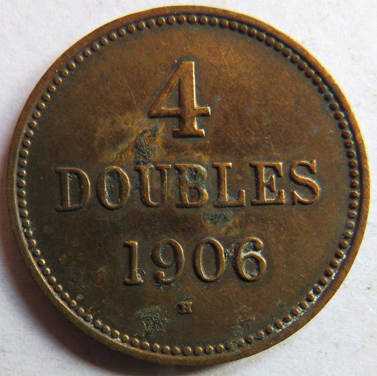 1906-H Guernsey 4 Doubles Coin