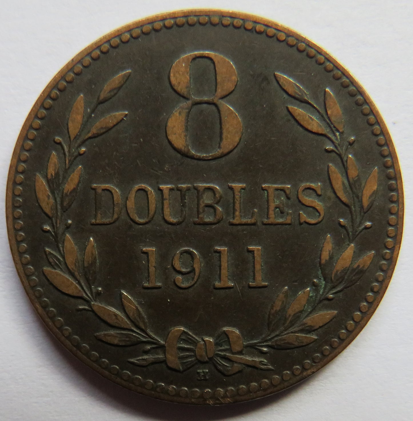 1911-H Guernsey 8 Doubles Coin