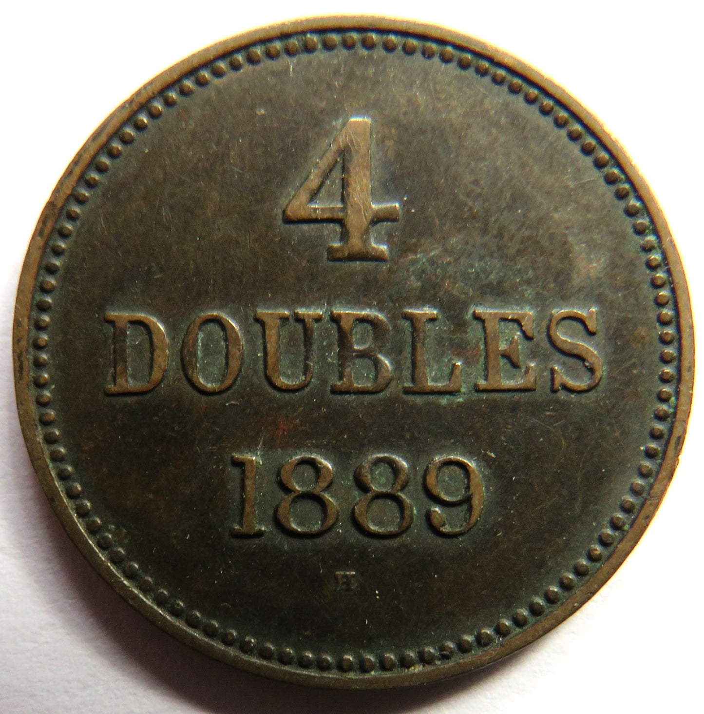 1889-H Guernsey 4 Doubles Coin