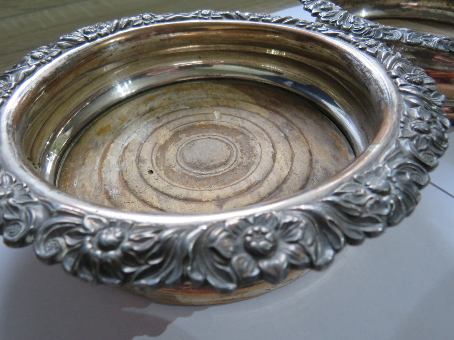 Antique Pair of Silver Plated Wine Coasters With Floral Decorations
