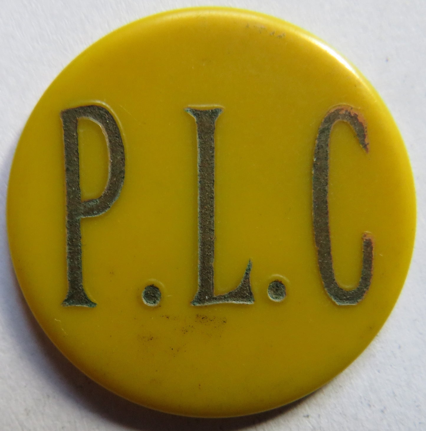 P.L.C. Vintage Yellow Plastic 1d Token