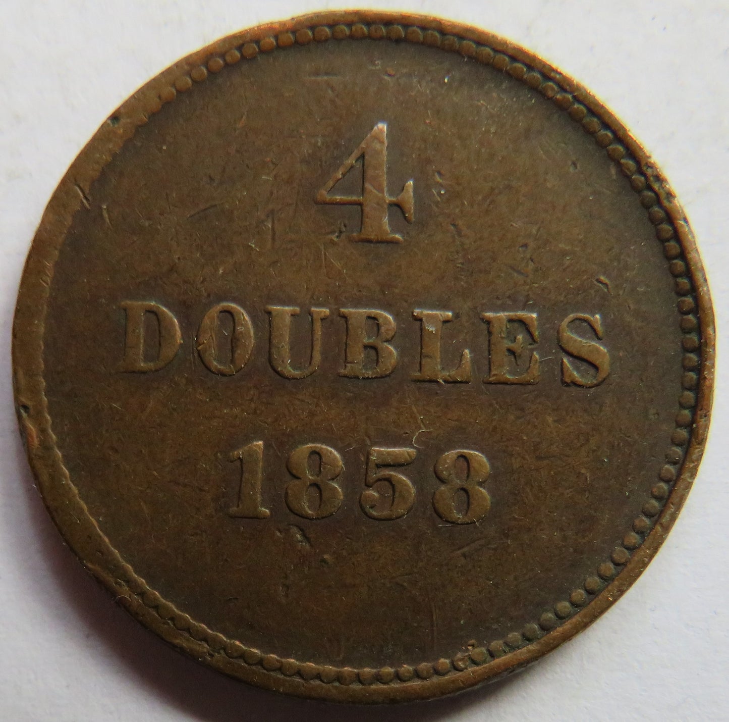 1858 Guernsey 4 Doubles Coin