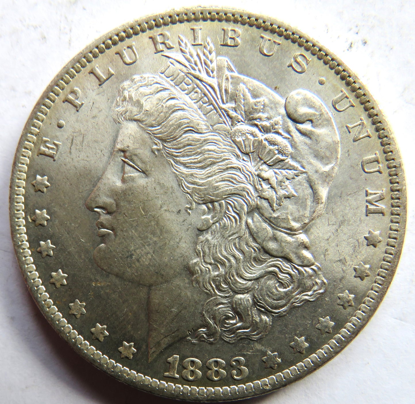1883-O USA Silver Morgan $1 Dollar Coin In Higher Grade