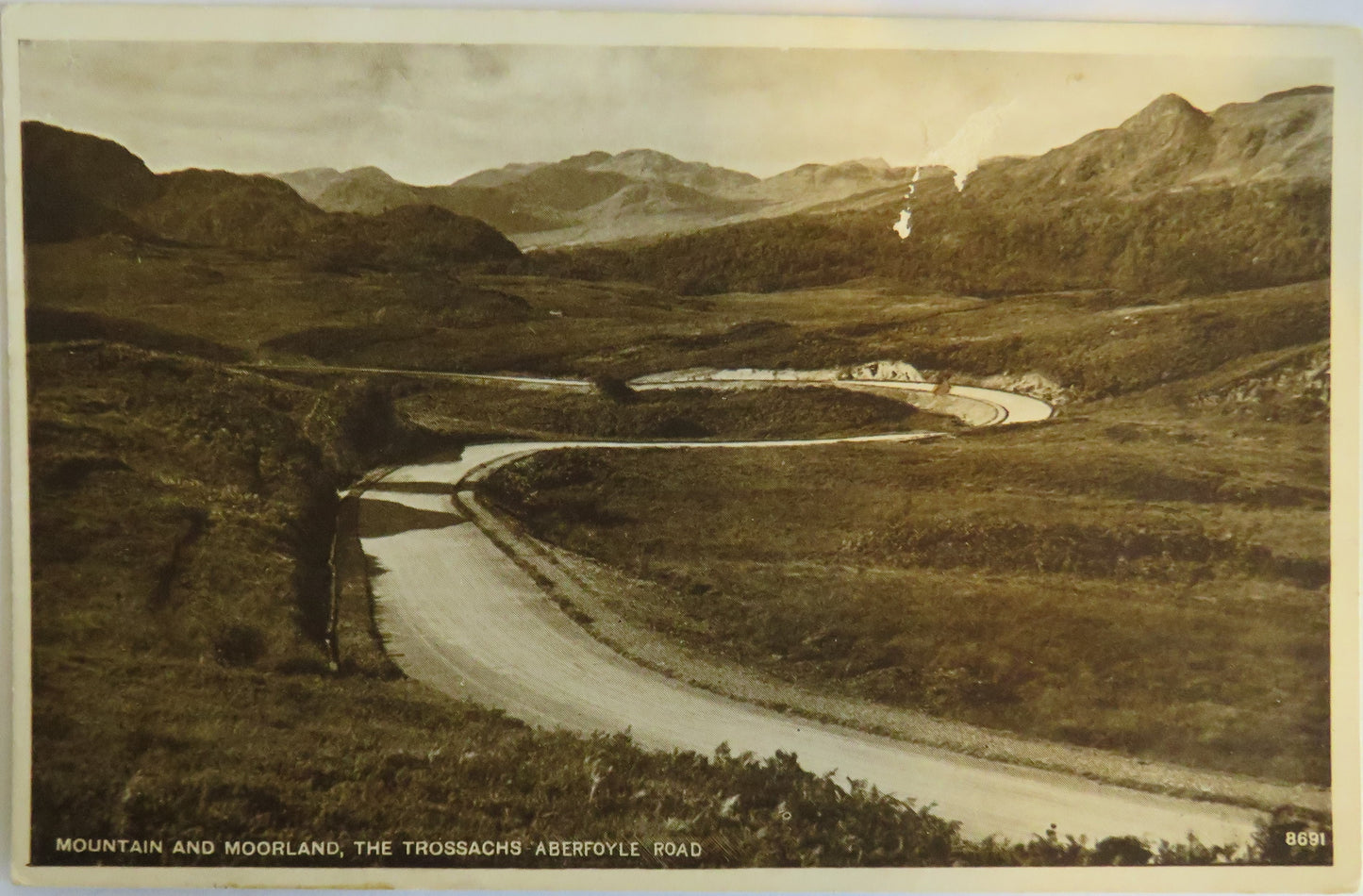 Old Postcard Of Mountain and Moorland, The Trossachs, Aberfoyle Road